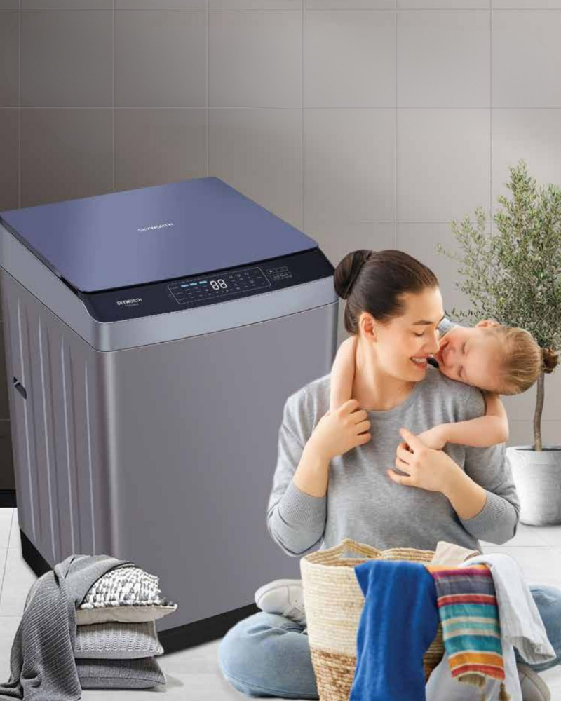 Skyworth top load washer beside a mother and child in a laundry room.