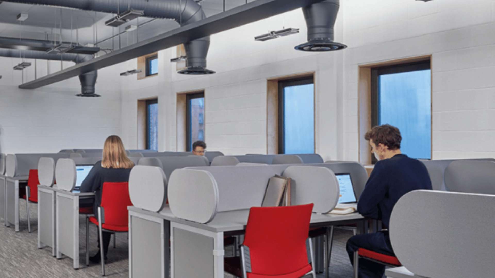 Students studying in a classroom equipped with Dyson technology.