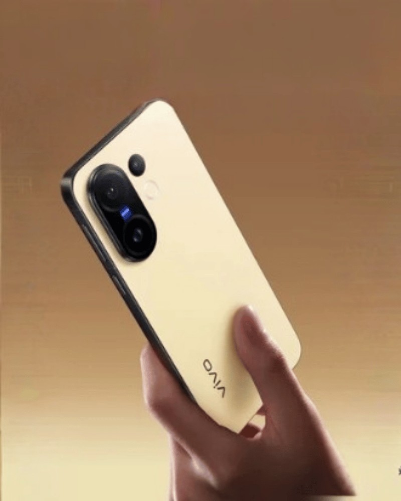 vivo X200 FE in gold held in hand.