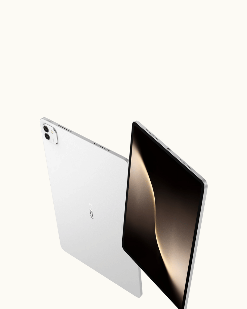 Honor Magic Pad 3 tablet in silver, shown with one device displaying a warm abstract screen and another angled to reveal a slim rear camera.