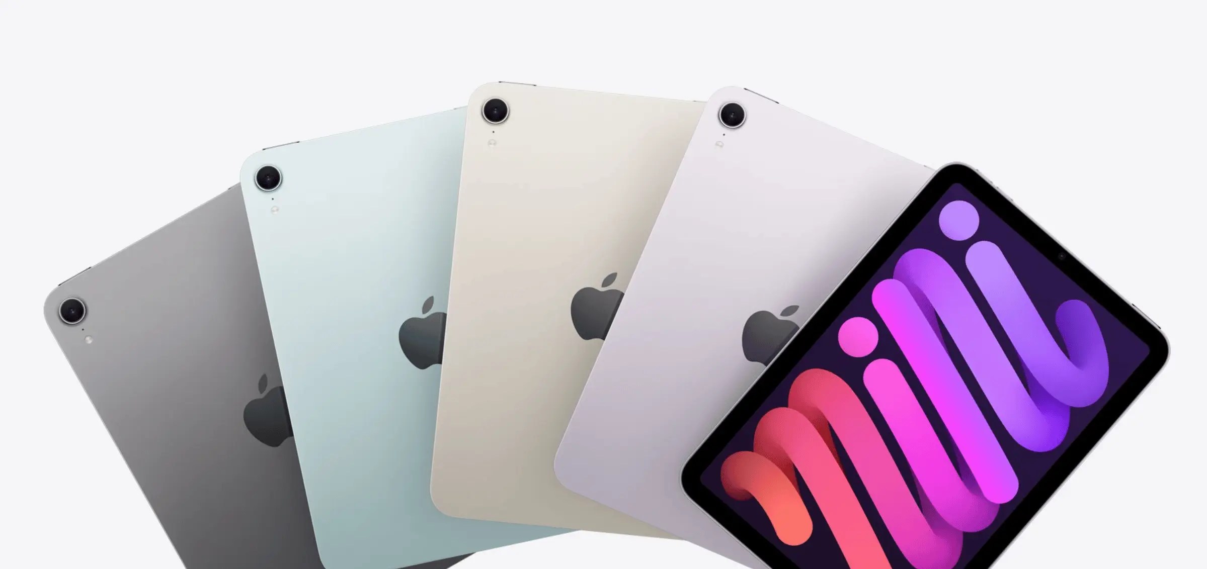 Fan layout of colourful iPad and iPad mini devices, showcasing slim backs and vibrant screens.