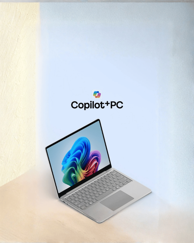 Microsoft Surface 13-inch laptop slightly open on a light cream background, with the Copilot+PC logo above and an offer for a free RM139 mouse.