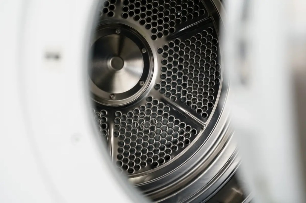 Dryer Machine Malaysia guide by Senheng Malaysia. Close-up view of an energy efficient clothes dryer drum.